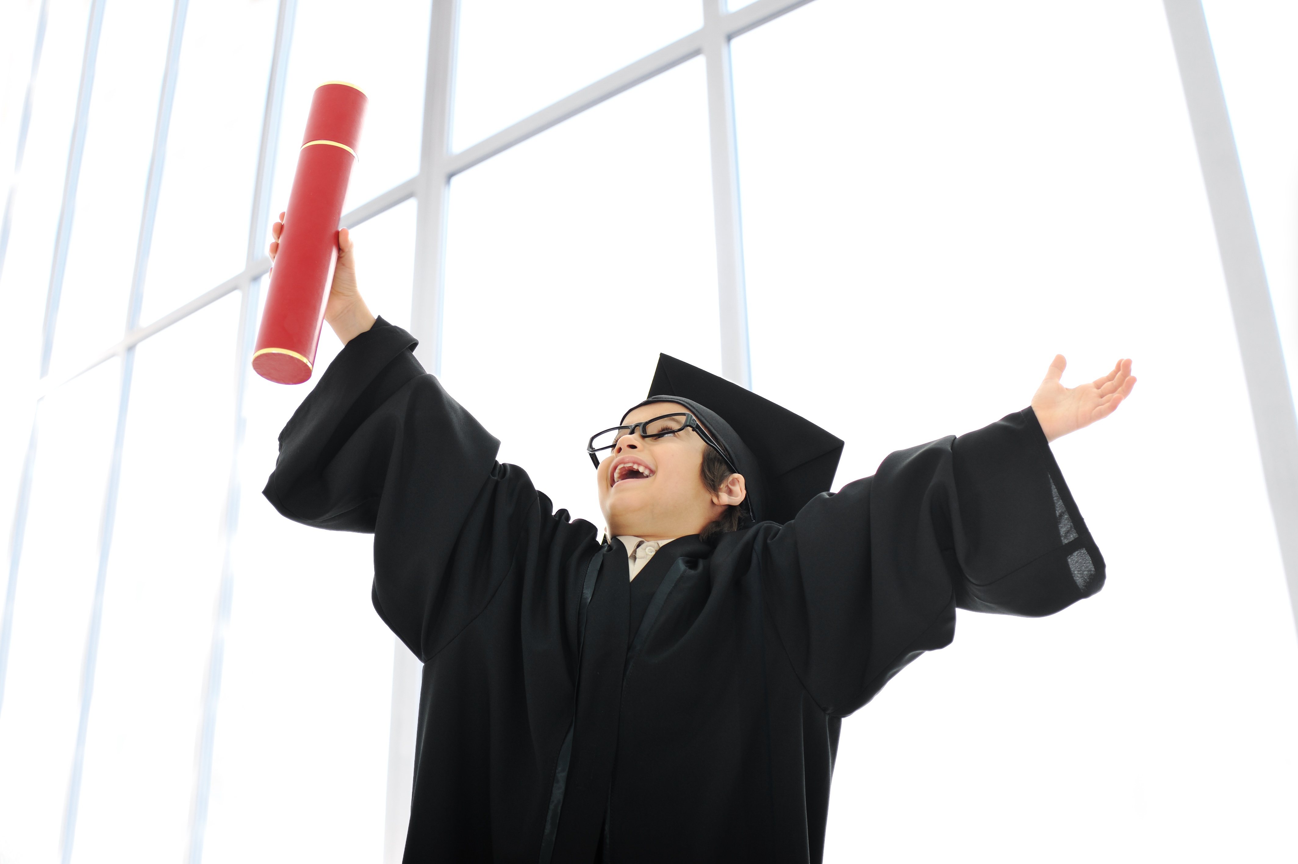 Kid celebrating graduating diploma HKglcPRTrs